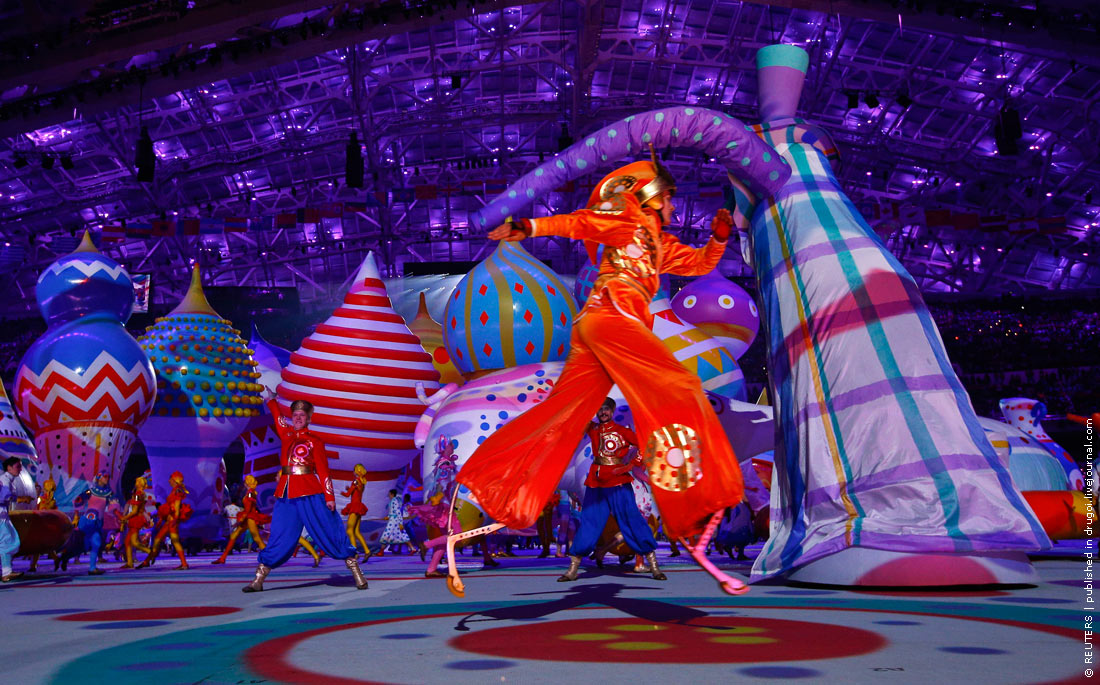 An acrobat performs during the opening ceremony of the 2014 Sochi Winter Olympic Games at Fisht stadium
