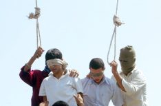 Blindfolded Mahmoud Asgari, 16, left, and another unidentified teenager are set to be publicly hanged,  in Mashhad, Iran, on charges of raping boys in this photo taken on July 19, 2005. Nobel Peace laureate Shirin Ebadi Saturday condemned the execution of two under-18 boys in northeastern Iran, a punishment that has also reportedly prompted protests by gay groups around the world.(AP Photo)