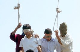 Blindfolded Mahmoud Asgari, 16, left, and another unidentified teenager are set to be publicly hanged, in Mashhad, Iran, on charges of raping boys in this photo taken on July 19, 2005. Nobel Peace laureate Shirin Ebadi Saturday condemned the execution of two under-18 boys in northeastern Iran, a punishment that has also reportedly prompted protests by gay groups around the world.(AP Photo)
