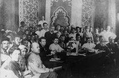 1920:  Group portrait of the delegates of the Congress of Eastern Peoples posing around a meeting table, Baku, Azerbaijan. American writer John Reed (in front wearing a dark suit) sits next to Soviet revolutionary Grigori Zinoviev (3rd from L).  (Photo by Hulton Archive/Getty Images)